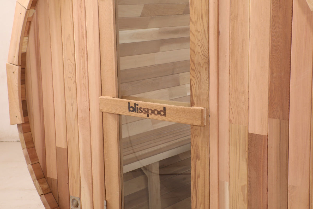 Wooden sauna with 'blisspod' branding on a light background
