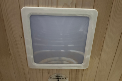 Pet door with a clear flap on a wooden wall